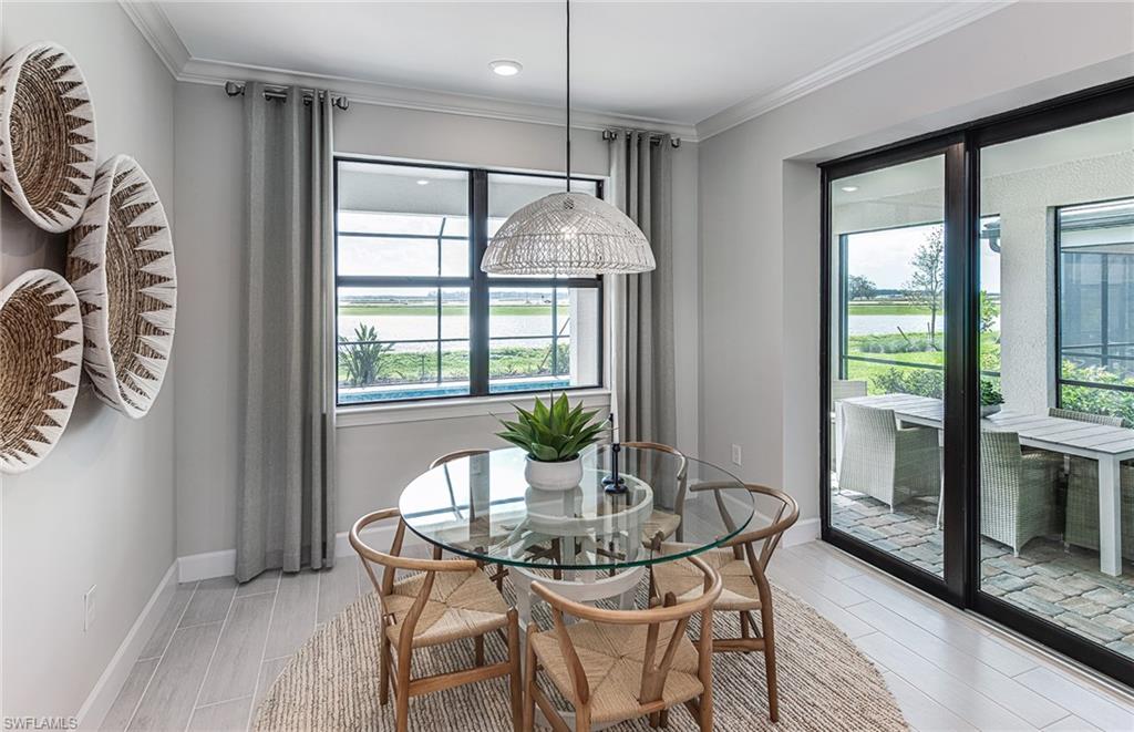 20322 Napa Loop Estero, FL 33928 - Photo 14 of 46 a dining room with furniture and window