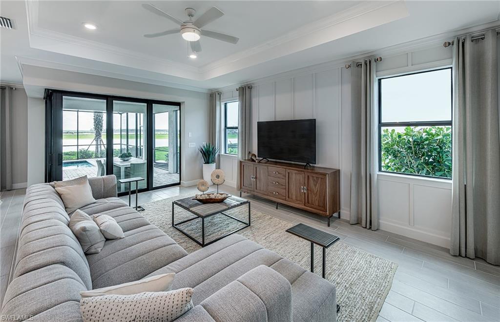 20322 Napa Loop Estero, FL 33928 - Photo 16 of 46 a living room with furniture and a flat screen tv