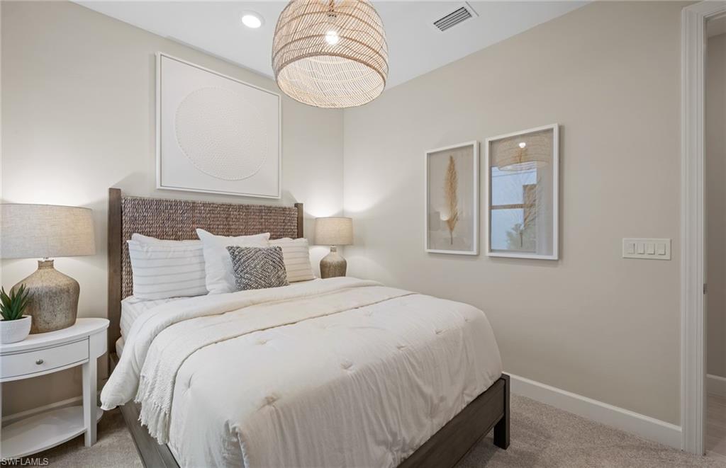 20322 Napa Loop Estero, FL 33928 - Photo 22 of 46 a bedroom with bed and window