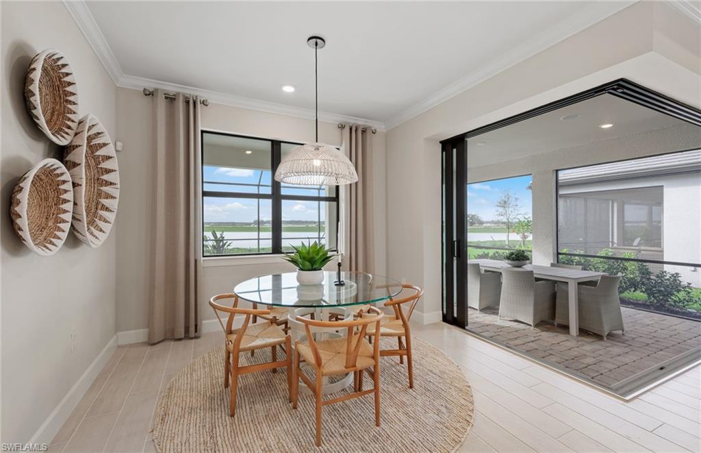20322 Napa Loop Estero, FL 33928 - Photo 24 of 46 a view of a dining room with furniture window and wooden floor