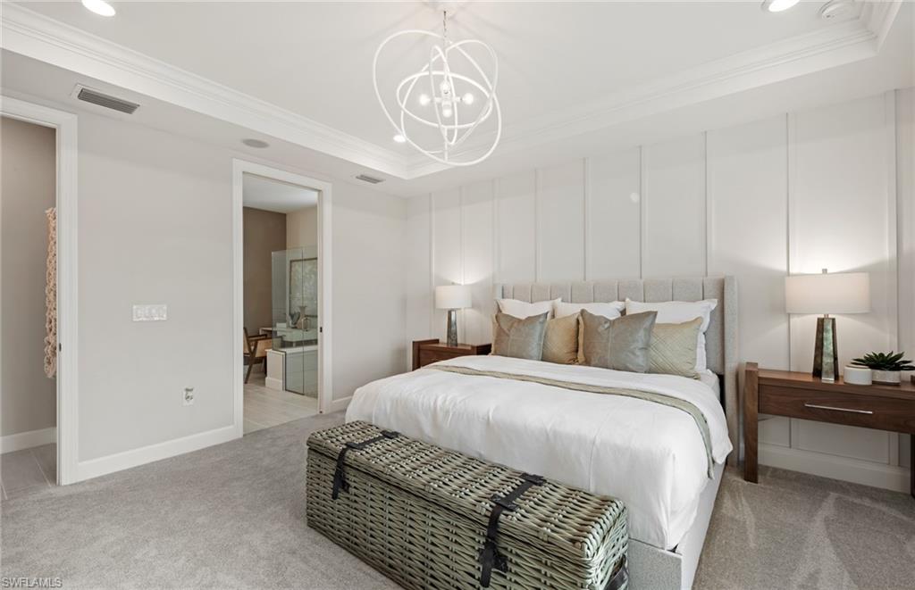 20322 Napa Loop Estero, FL 33928 - Photo 36 of 46 a bedroom with a bed and a chandelier