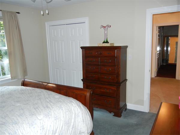 81 Clark Road Sturbridge, MA 01518 - Photo 12 of 21 a bedroom with a bed and a dresser