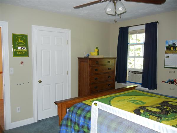 81 Clark Road Sturbridge, MA 01518 - Photo 14 of 21 a bedroom with a bed and a table