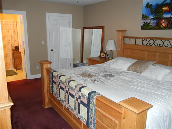 81 Clark Road Sturbridge, MA 01518 - Photo 9 of 21 a bedroom with a bed and wooden floor