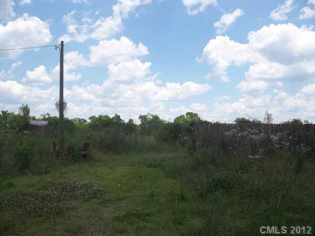 7515 Wolf Pond Road Monroe, NC 28112 - Photo 3 of 9 a view of a city from a yard