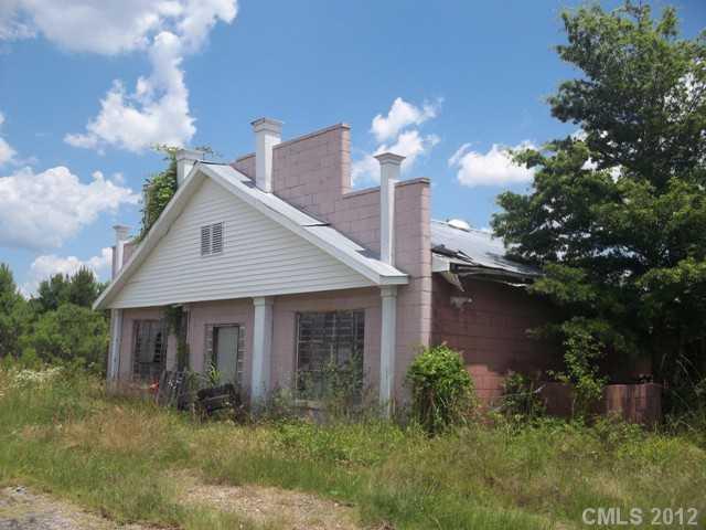 7515 Wolf Pond Road Monroe, NC 28112 - Photo 7 of 9 a front view of a house with garden