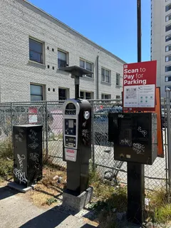a front view of a building with parking area