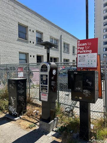a front view of a building with parking area