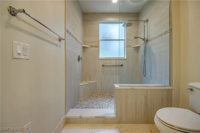 a spacious bathroom with a double vanity sink a large mirror a shower and a bathtub