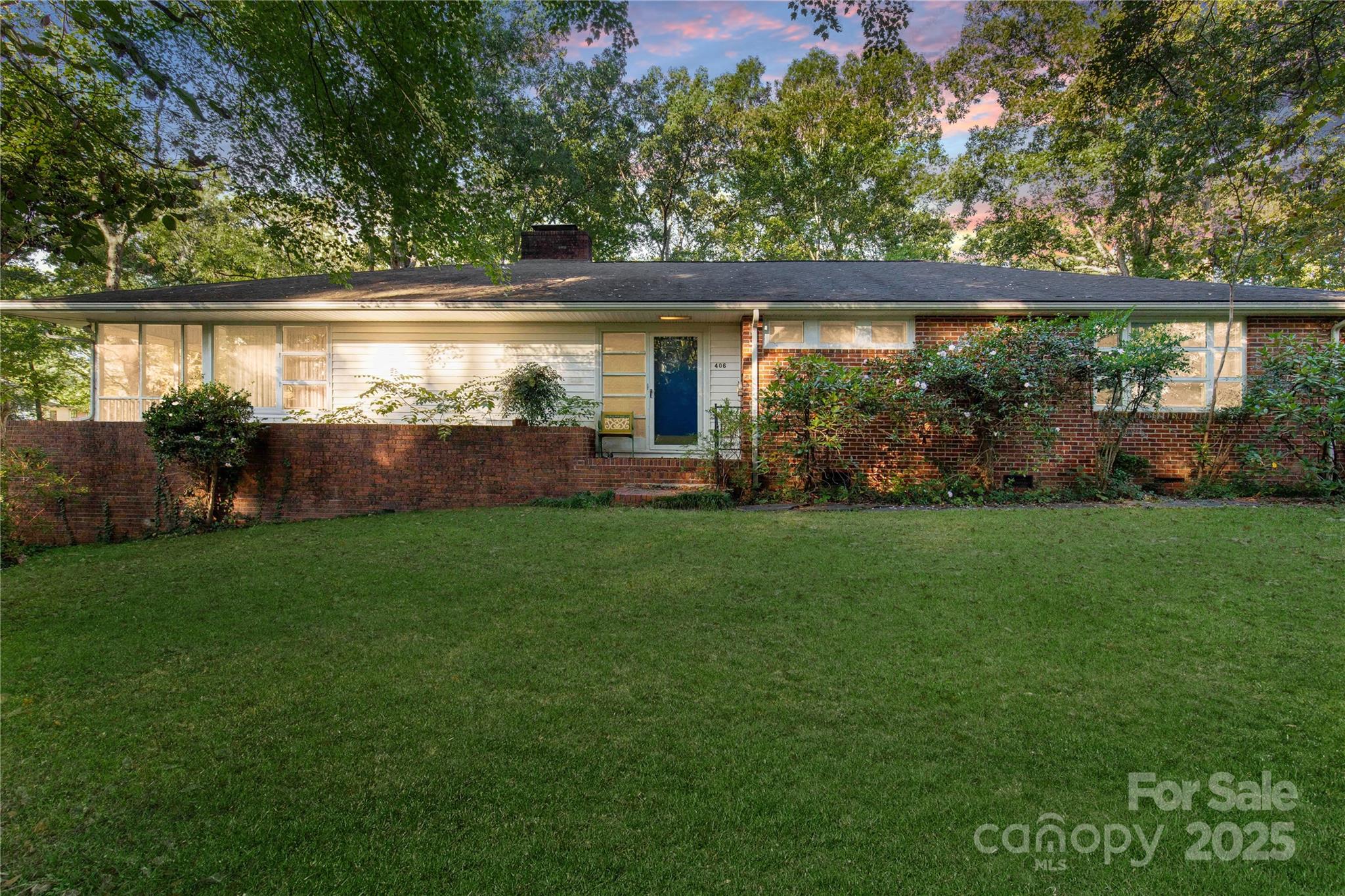 406 Pine Street Lancaster, SC 29720 - Photo 3 of 31 a view of house with backyard and garden