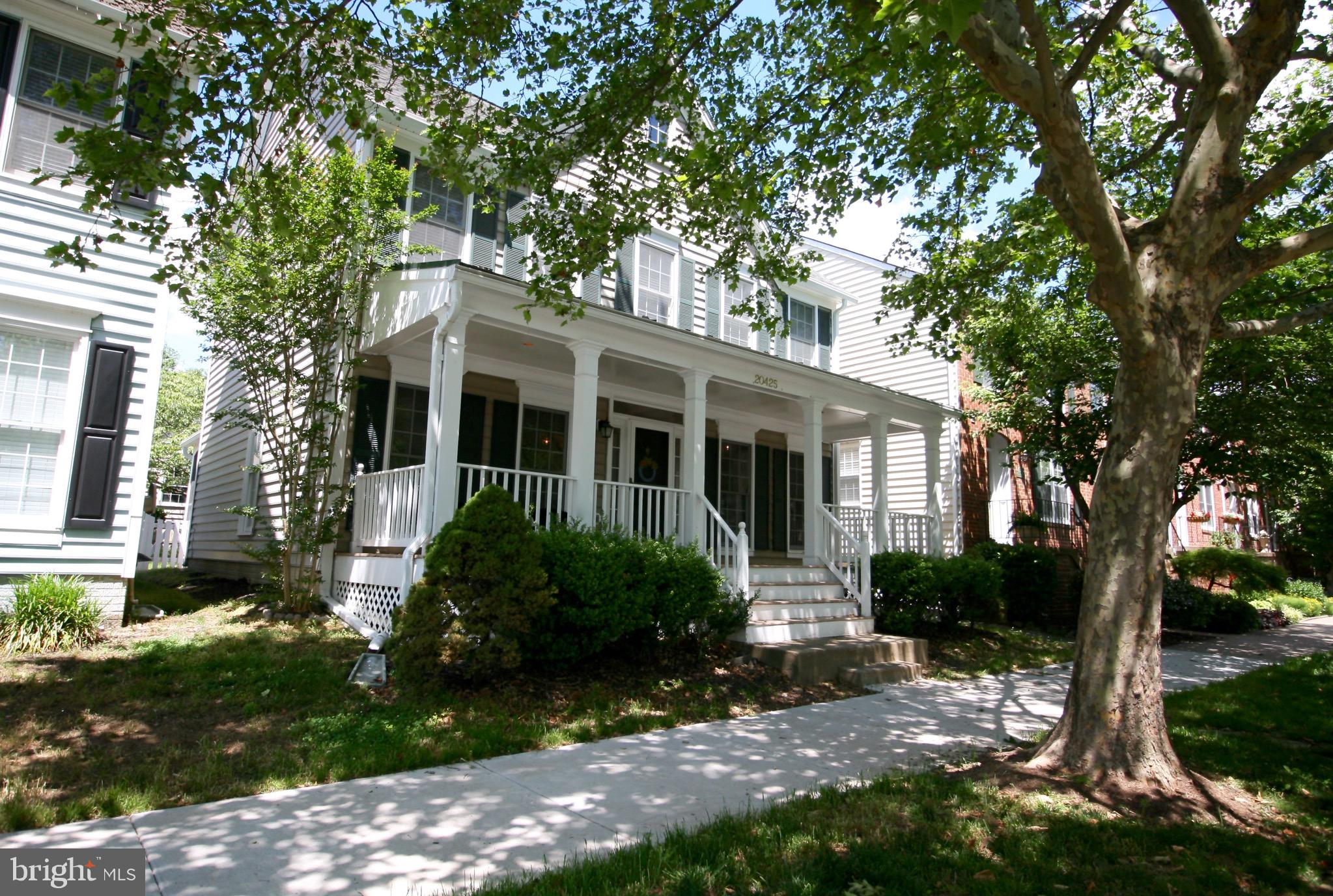 20425 Charter Oak Drive Ashburn, VA 20147 - Photo 1 of 25 a front view of a house with garden
