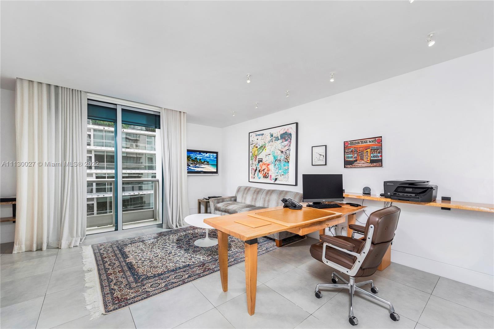 9401 Collins Avenue, Unit 607 Surfside, FL 33154 - Photo 23 of 58 a workspace with furniture and a window