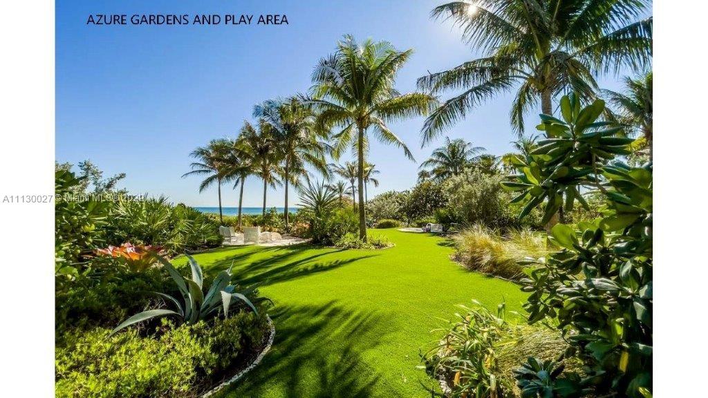 9401 Collins Avenue, Unit 607 Surfside, FL 33154 - Photo 54 of 58 a yellow house with a garden in front of it