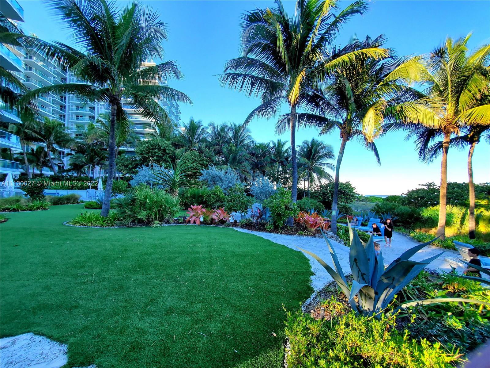9401 Collins Avenue, Unit 607 Surfside, FL 33154 - Photo 58 of 58 a view of a yard with a palm tree