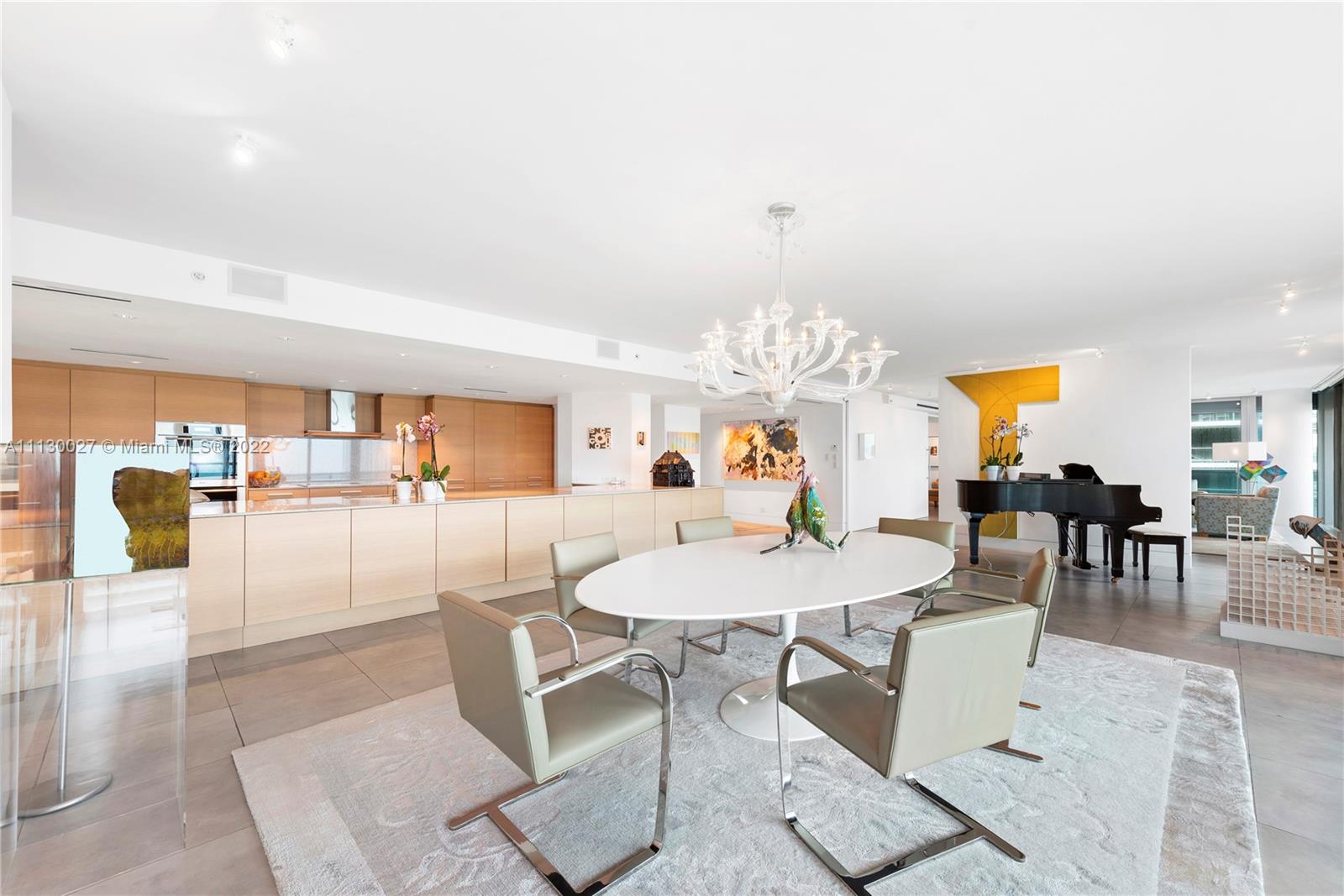 9401 Collins Avenue, Unit 607 Surfside, FL 33154 - Photo 6 of 58 a view of a dining room with furniture