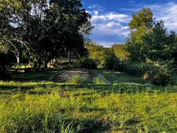 a view of lake with green space