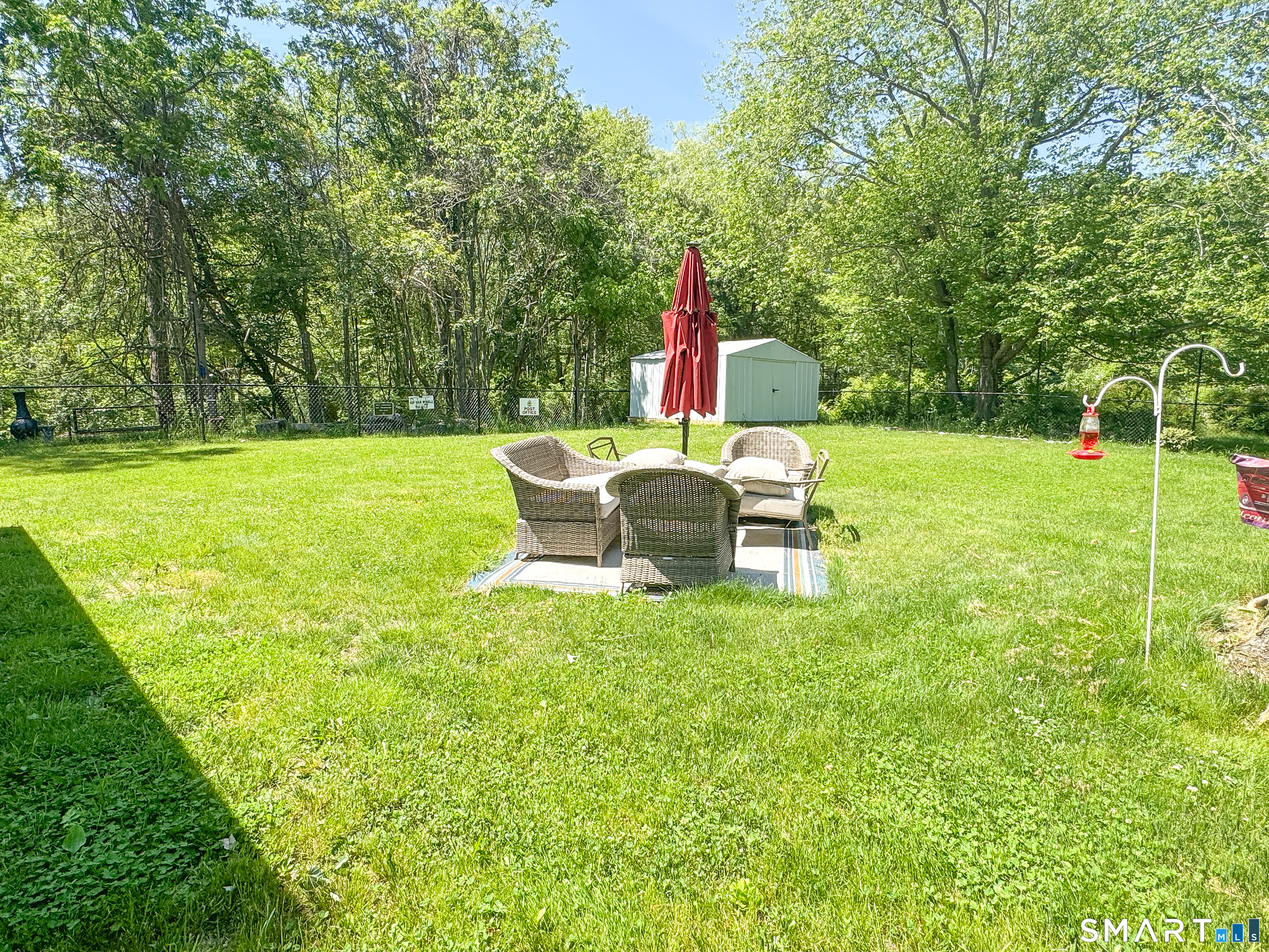 36 Jennings Street Norwich, CT 06360 - Photo 26 of 33 a view of a garden with a table and chairs