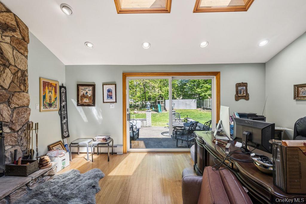 10 Elyise Road Monsey, NY 10952 - Photo 11 of 40 a living room with furniture and a flat screen tv