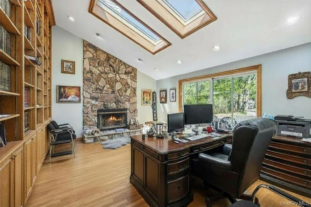 10 Elyise Road Monsey, NY 10952 - Photo 12 of 40 a living room with furniture a fireplace and a flat screen tv