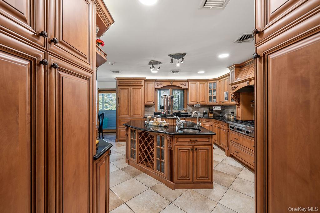 10 Elyise Road Monsey, NY 10952 - Photo 13 of 40 a kitchen with stainless steel appliances granite countertop a stove and a refrigerator