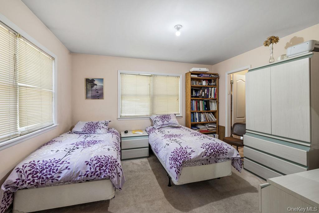 10 Elyise Road Monsey, NY 10952 - Photo 20 of 40 a bedroom with a bed cabinets and window