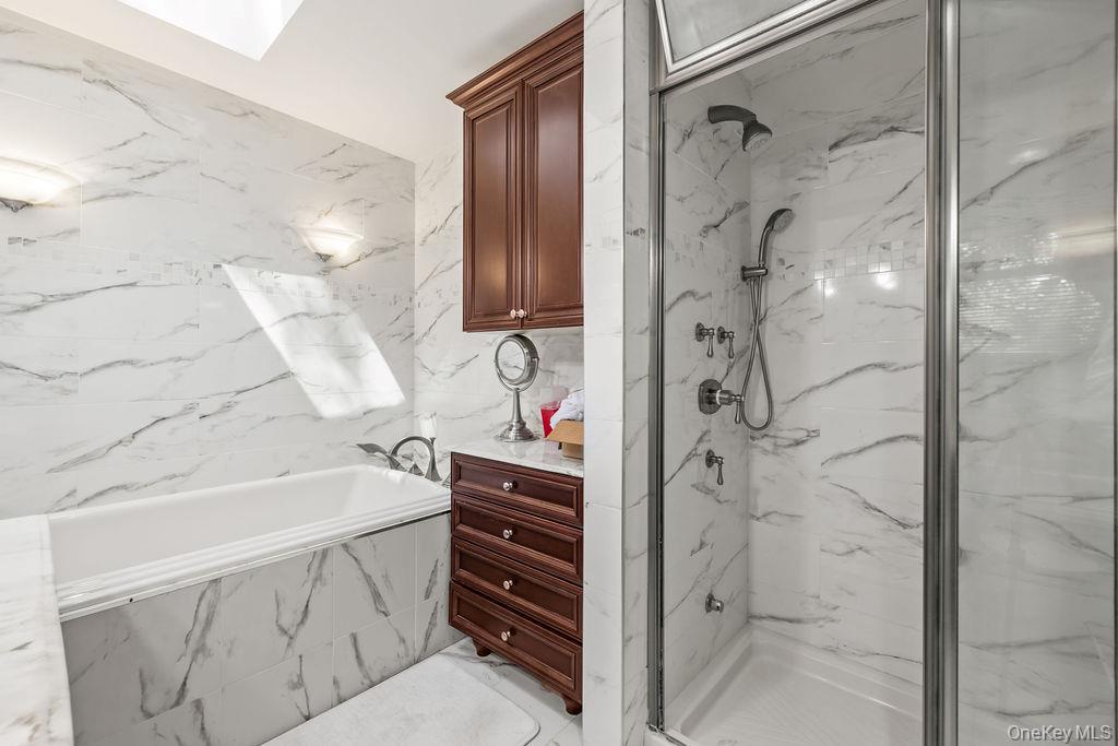 10 Elyise Road Monsey, NY 10952 - Photo 26 of 40 a bathroom with a bathtub and a shower