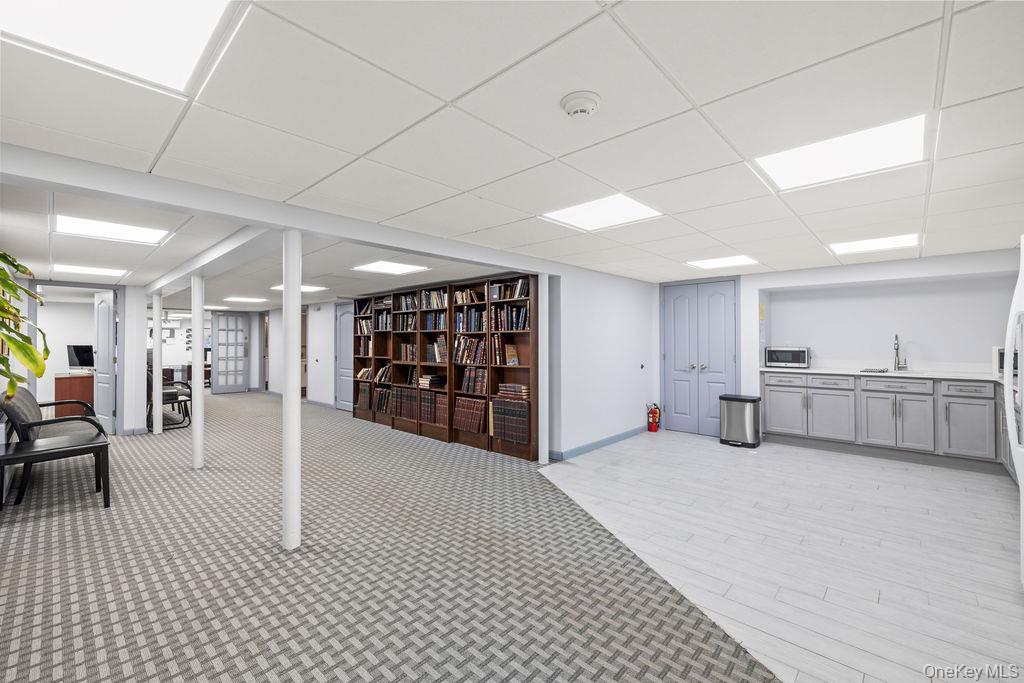 10 Elyise Road Monsey, NY 10952 - Photo 29 of 40 a large room with lots of furniture and white walls