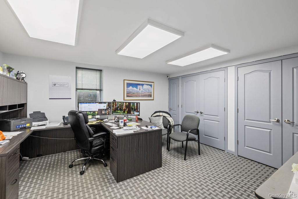 10 Elyise Road Monsey, NY 10952 - Photo 34 of 40 a work room with furniture a rug and white walls