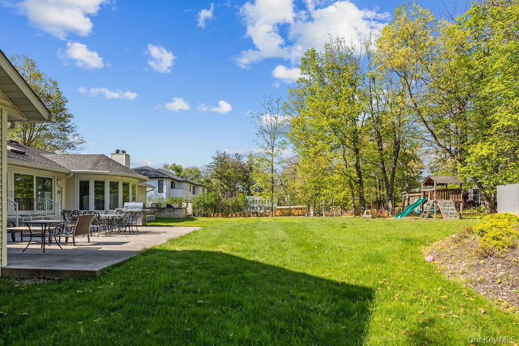 10 Elyise Road Monsey, NY 10952 - Photo 35 of 40 a front view of a house with a garden and sitting area
