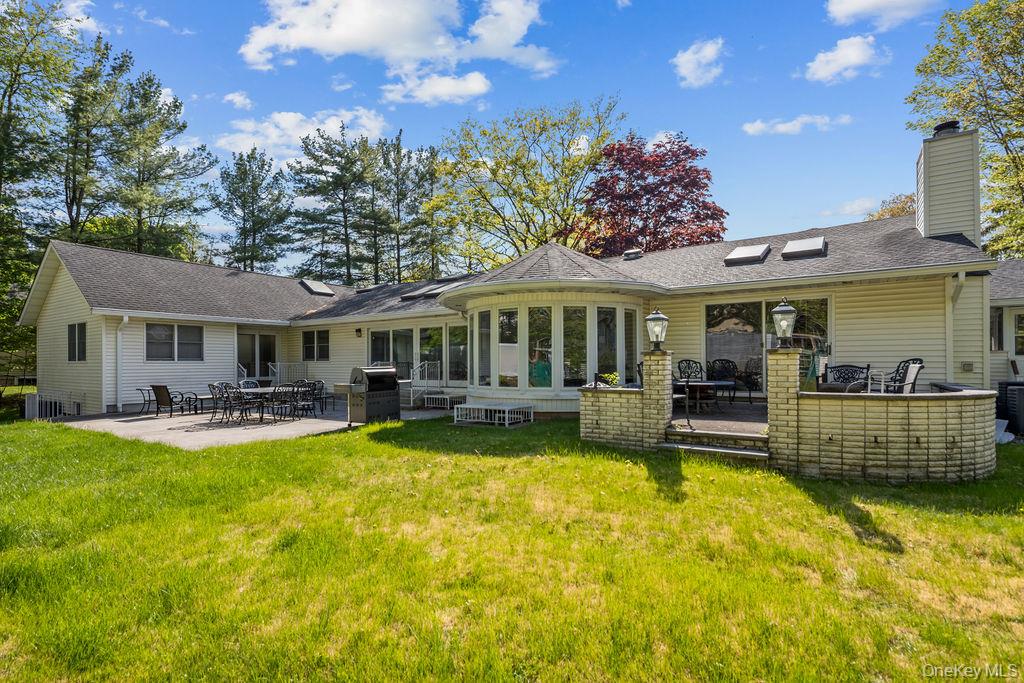 10 Elyise Road Monsey, NY 10952 - Photo 37 of 40 a view of a house with swimming pool and sitting area