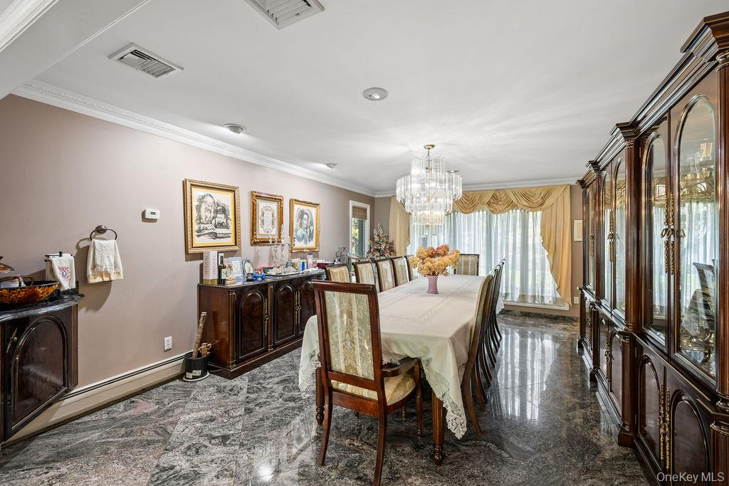 10 Elyise Road Monsey, NY 10952 - Photo 8 of 40 a dining room with furniture window and wooden floor