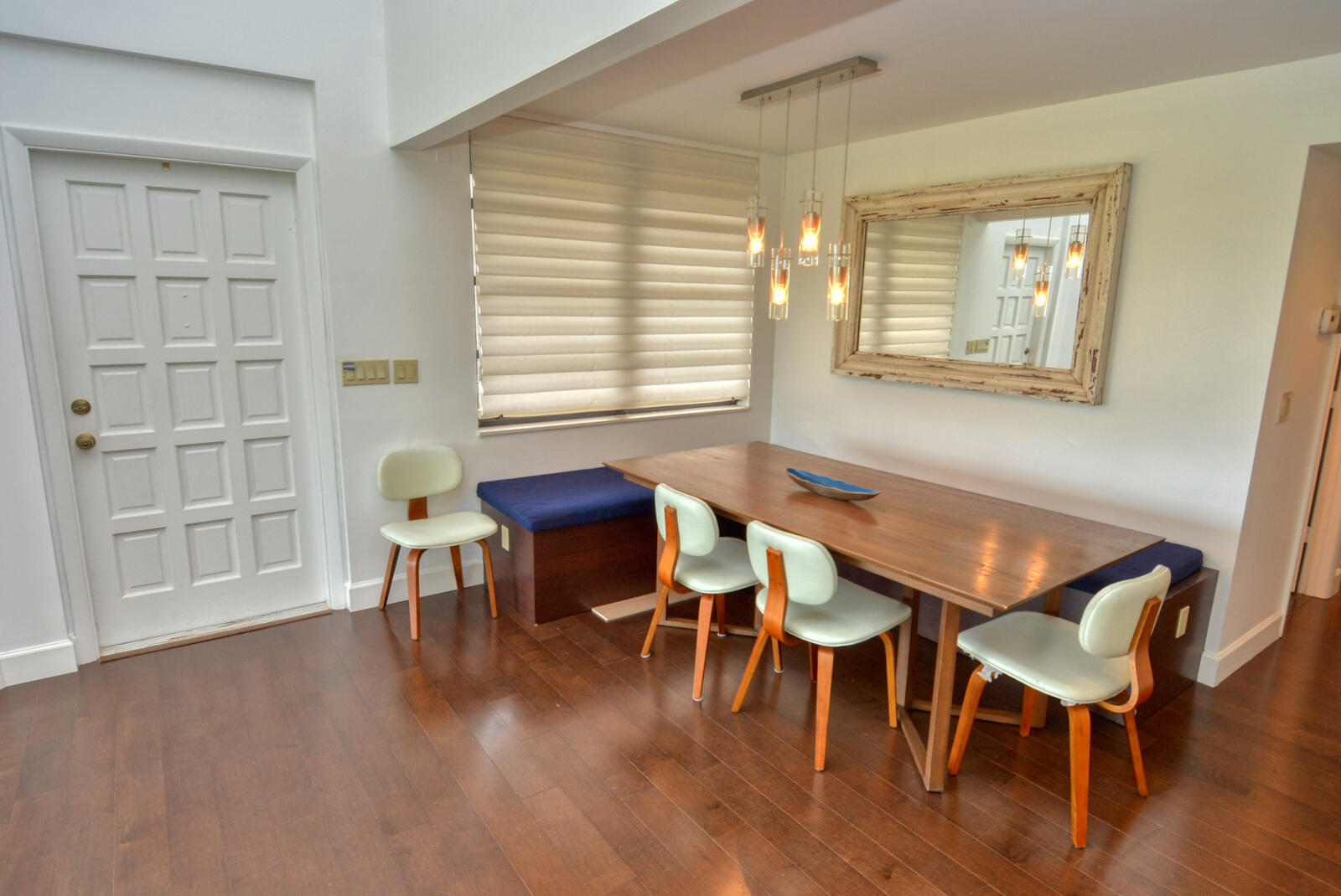 318 Golfview Circle Stuart, FL 34996 - Photo 12 of 39 a view of a dining room with furniture and wooden floor