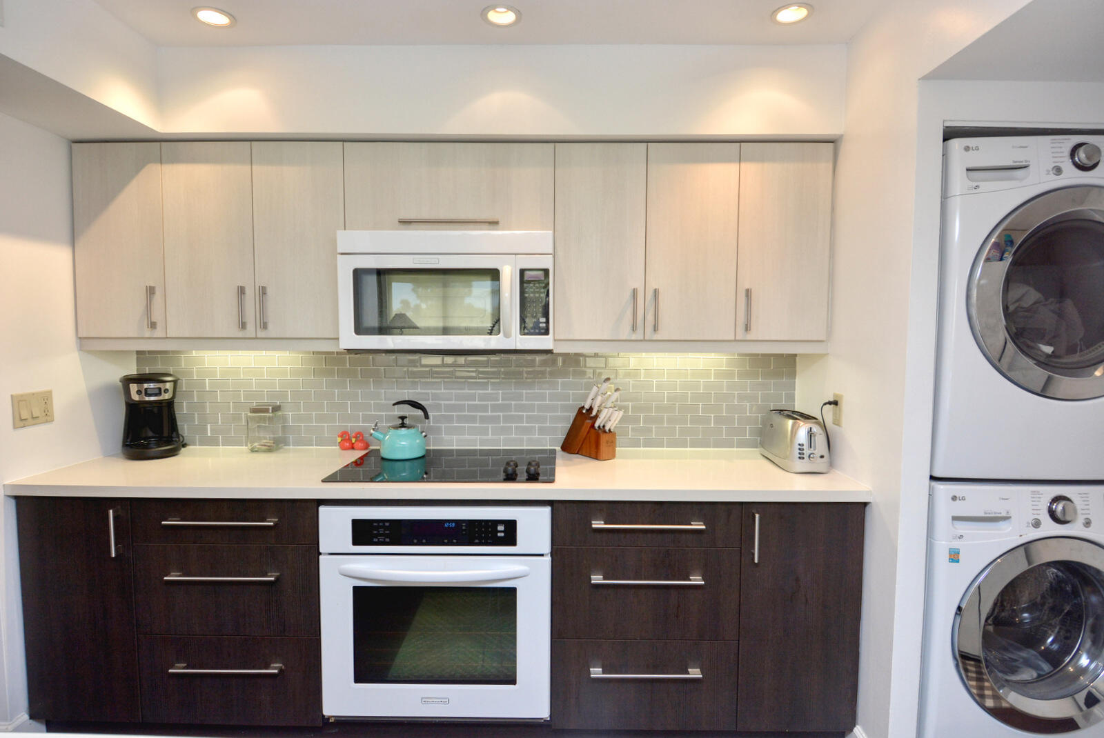 318 Golfview Circle Stuart, FL 34996 - Photo 19 of 39 a kitchen with stainless steel appliances granite countertop a sink a stove and cabinets