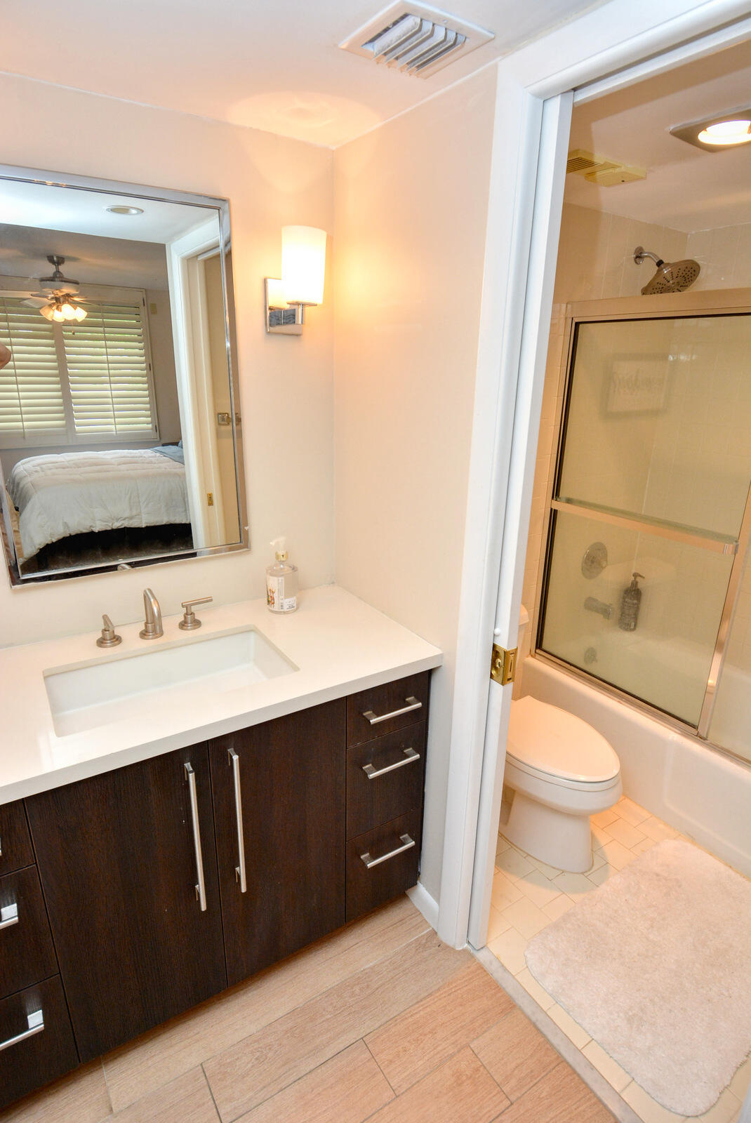 318 Golfview Circle Stuart, FL 34996 - Photo 28 of 39 a bathroom with a sink a toilet and mirror