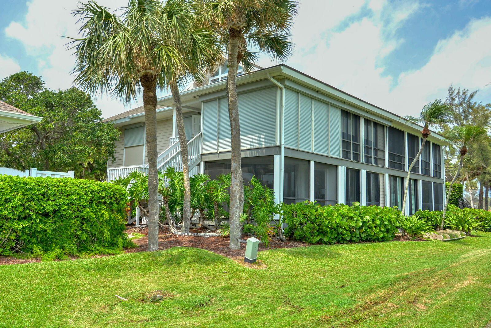 318 Golfview Circle Stuart, FL 34996 - Photo 3 of 39 a house with trees in the background