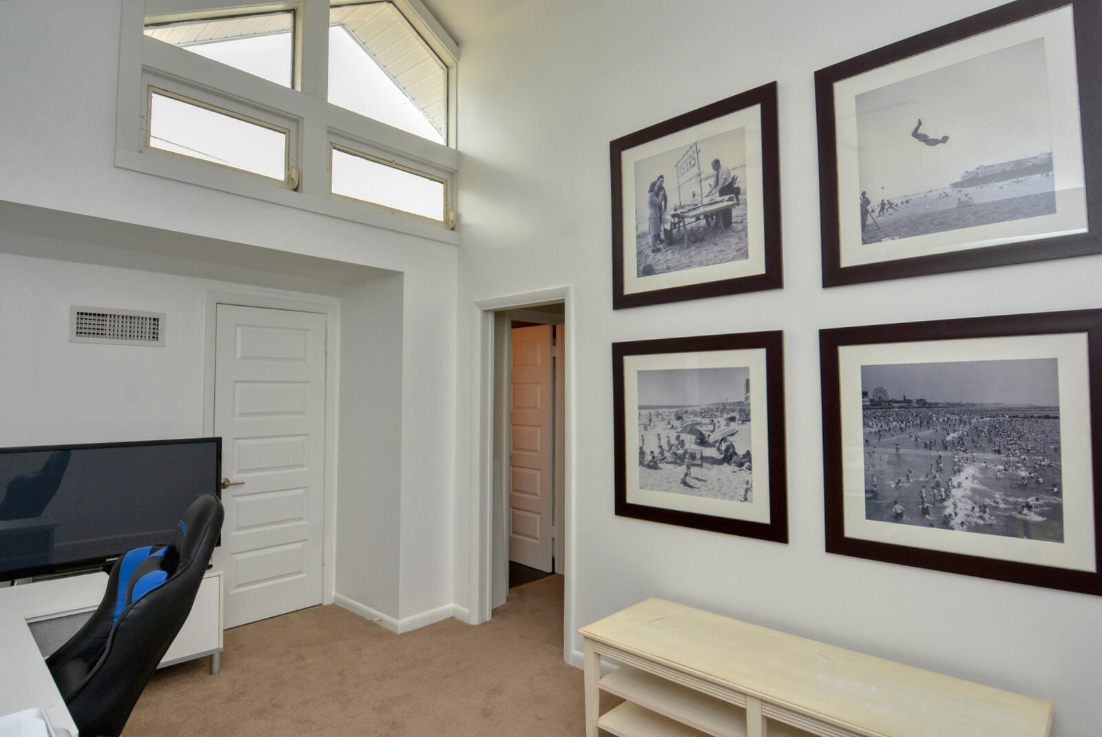 318 Golfview Circle Stuart, FL 34996 - Photo 34 of 39 a bathroom with a painting on the wall and a potted plant