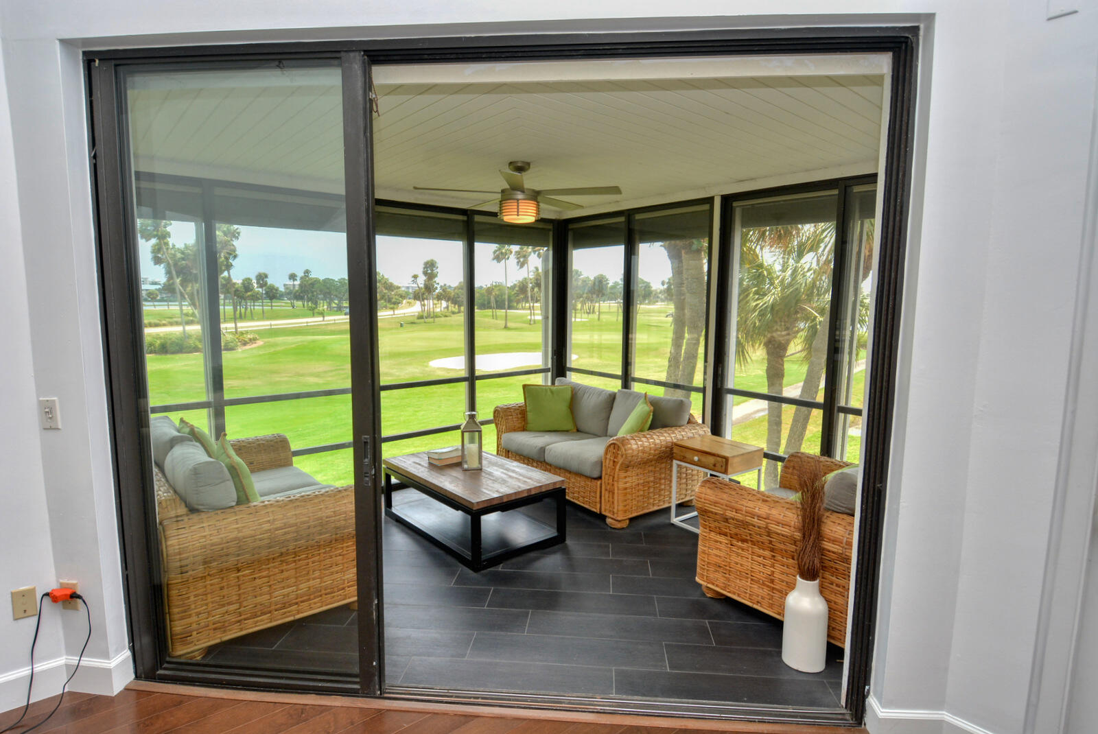 318 Golfview Circle Stuart, FL 34996 - Photo 8 of 39 a living room with furniture and a floor to ceiling window
