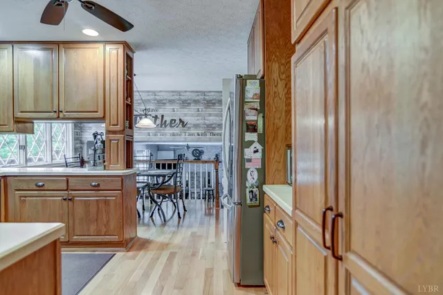 a view of a kitchen cabinets and wooden floor