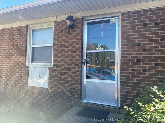 a view of a livingroom with wooden floor