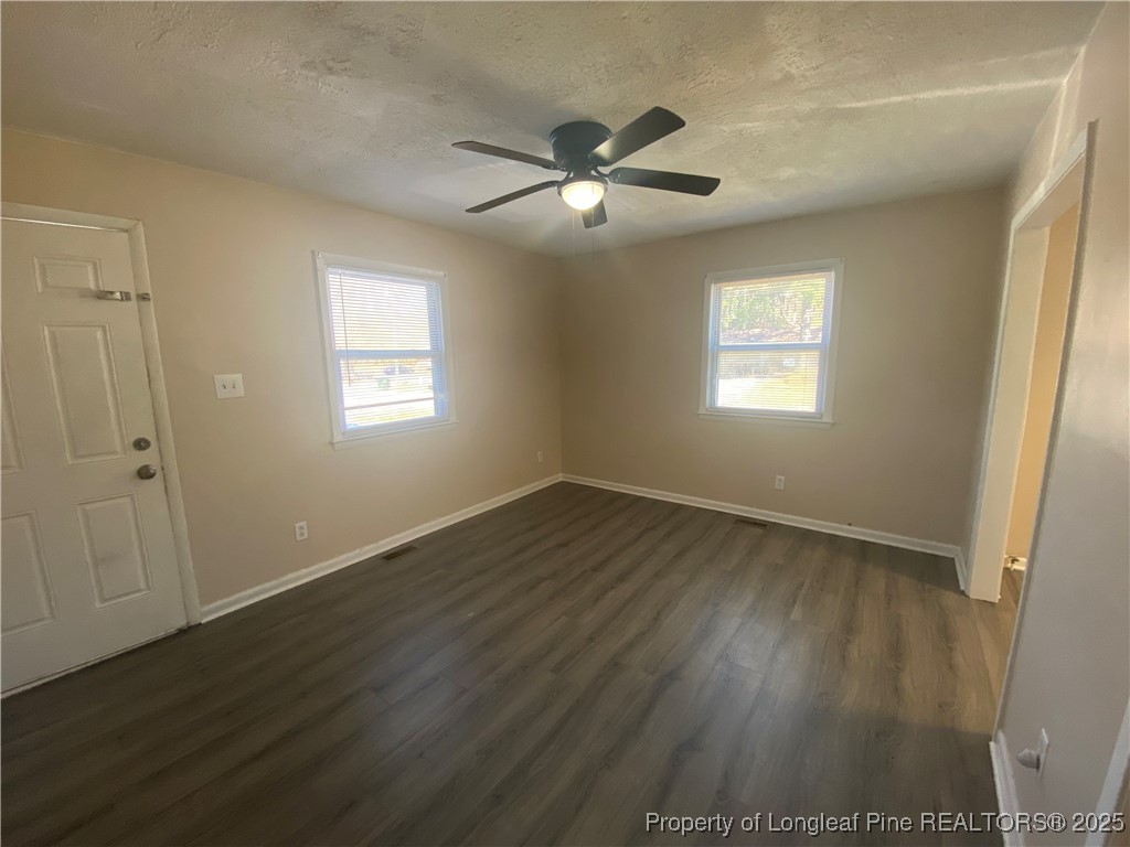 4959 B Fieldcrest Drive Fayetteville, NC 28303 - Photo 3 of 8 a view of an empty room with wooden floor and a window