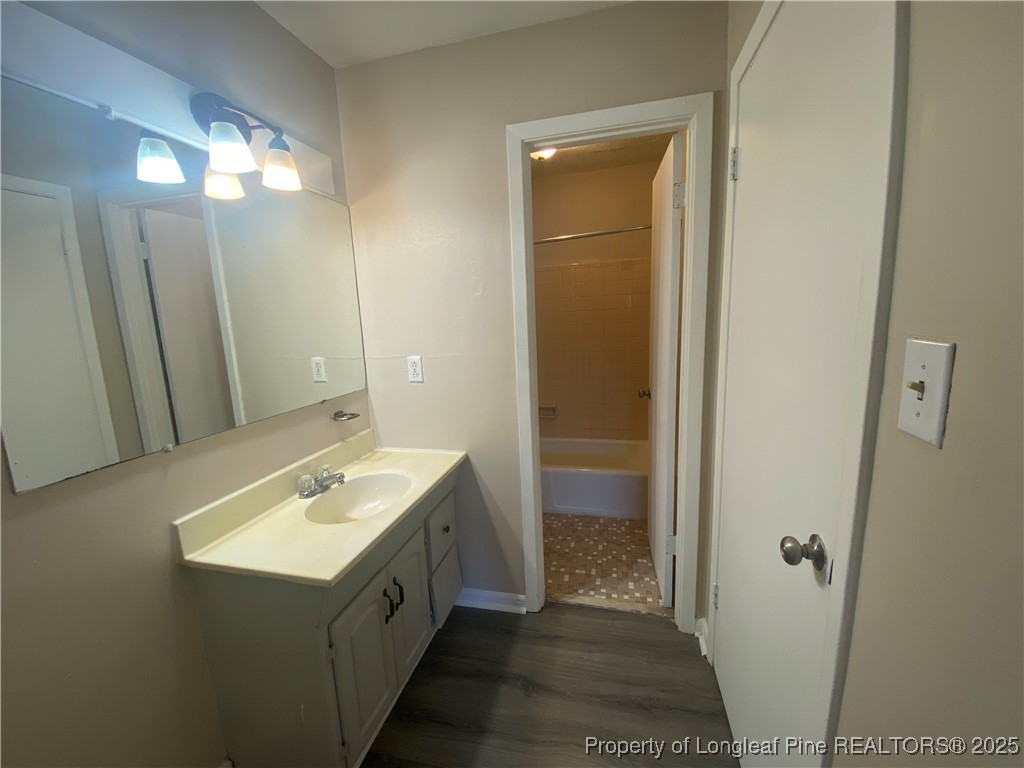 4959 B Fieldcrest Drive Fayetteville, NC 28303 - Photo 8 of 8 a bathroom with a double vanity sink and a mirror