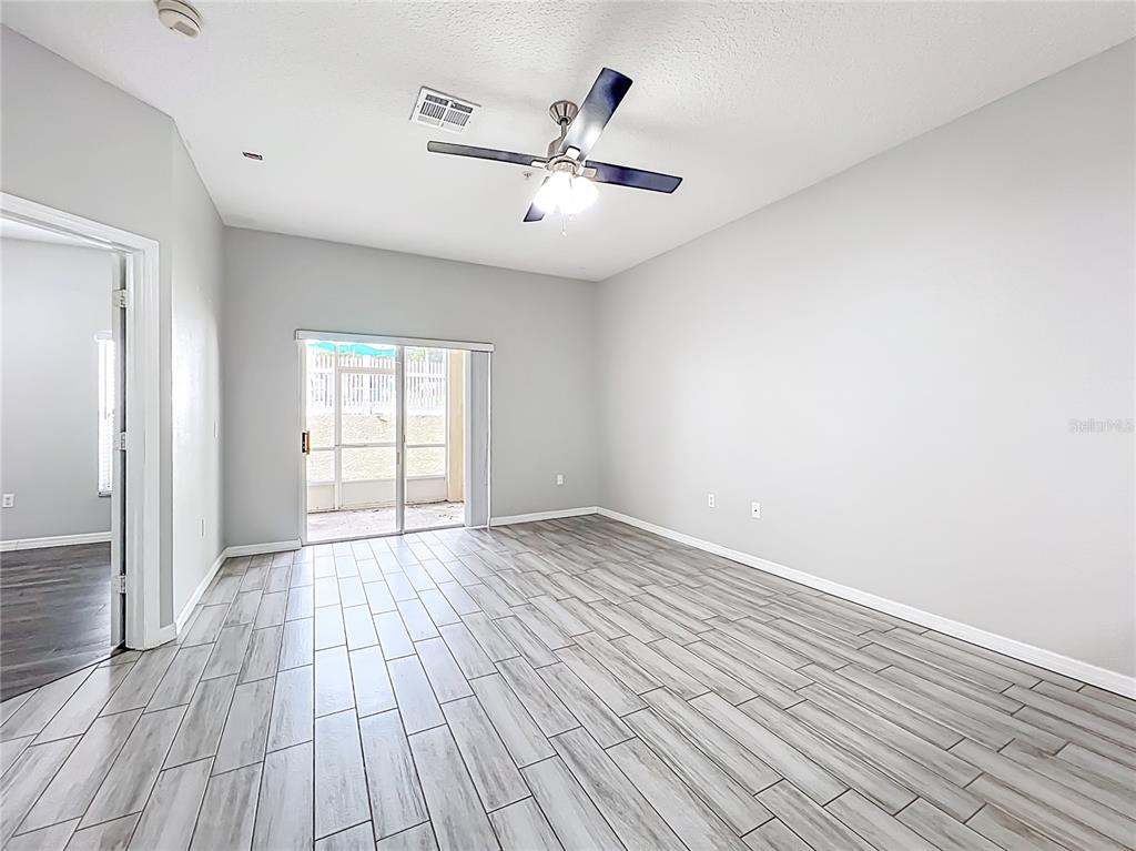 671 Sandy Neck Lane, Unit 102 Altamonte Springs, FL 32714 - Photo 15 of 37 wooden floor in an empty room with a window