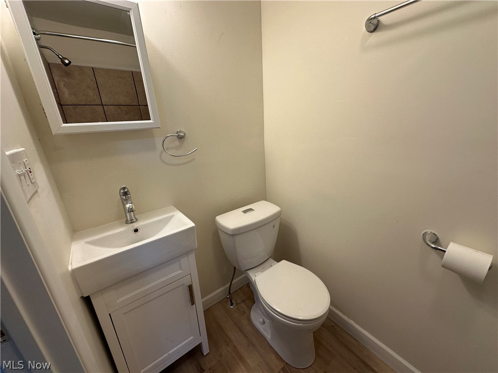 119 Shields Road, Unit 3 Youngstown, OH 44512 - Photo 5 of 12 Bathroom with wood finished floors and vanity