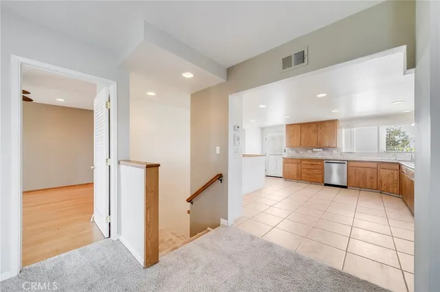 a view of a terrace with a table and chairs