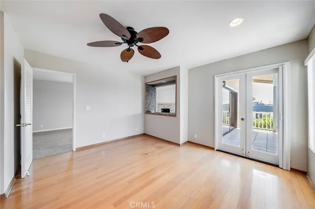 a spacious bathroom with a toilet sink and mirror