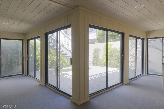 a view of entryway and hall with a couch