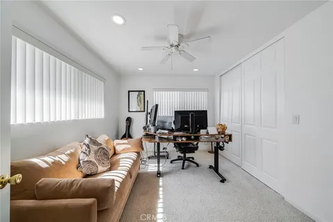 a bathroom with a double vanity sink a toilet and shower