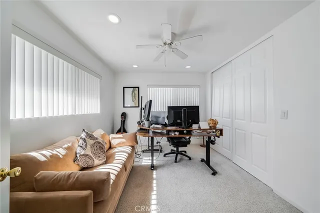 a bathroom with a double vanity sink a toilet and shower