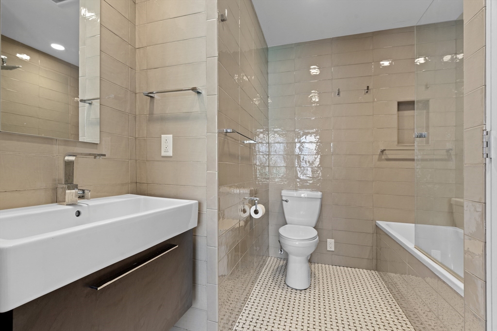 40 Fay Street, Unit 206 Boston, MA 02118 - Photo 6 of 9 a bathroom with a sink a toilet and shower