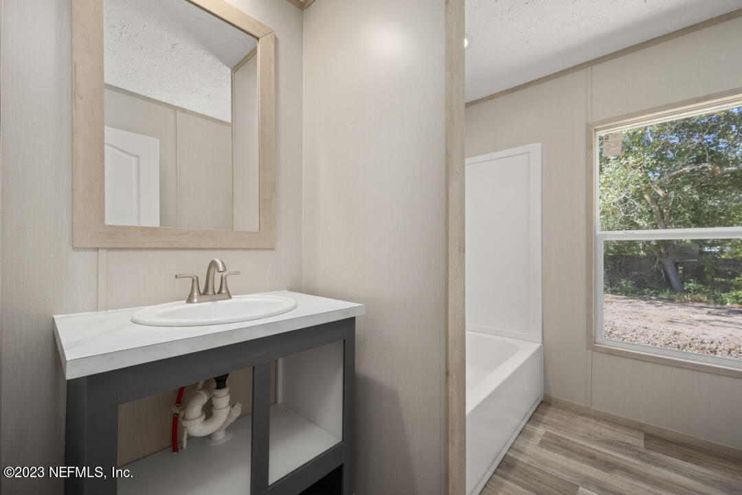 0 Chuck Road Jacksonville, FL 32221 - Photo 19 of 29 a bathroom with a sink and a mirror